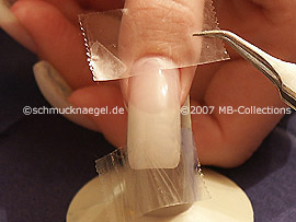 Clear adhesive tape and tweezers