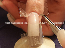 Clear adhesive tape and tweezers
