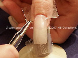 Clear adhesive tape and tweezers