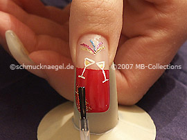The clear nail lacquer protects the nail art