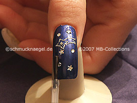 The clear nail lacquer protects the nail art