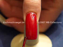 Nail lacquer in the colour red